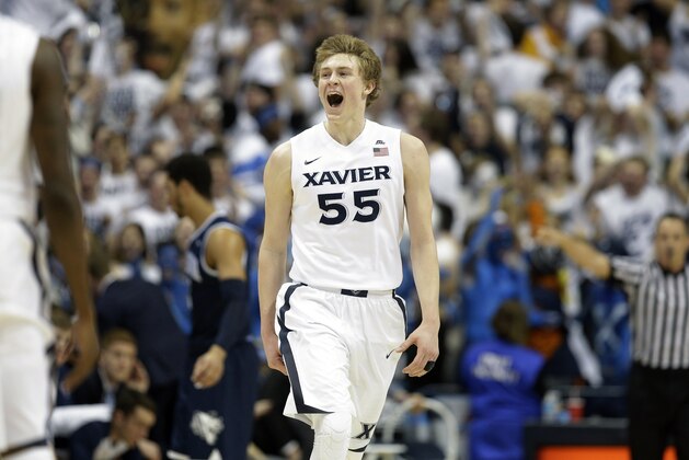 Xavier's J.P. Macura reacts during the first half of an NCAA college basketball game against Villanova, Wednesday, Feb. 24, 2016, in Cincinnati. (AP Photo/John Minchillo)