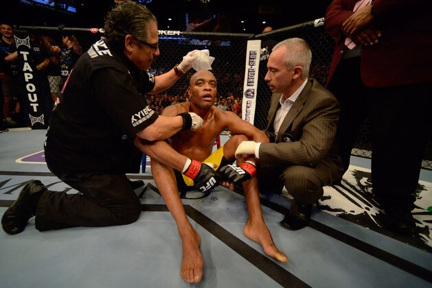 LAS VEGAS, NV - JULY 06:  A dejected Anderson Silva sits in the Octagon afer his knockout loss to Chris Weidman in their UFC middleweight championship fight during the UFC 162 event inside the MGM Grand Garden Arena on July 6, 2013 in Las Vegas, Nevada.  (Photo by Donald Miralle/Zuffa LLC/Zuffa LLC via Getty Images)