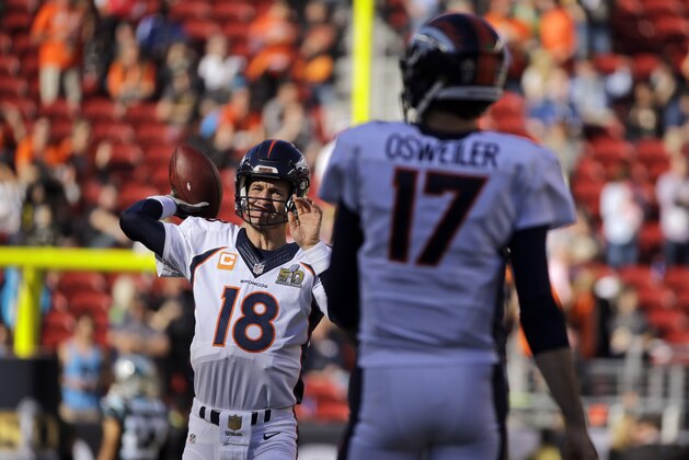 Denver Broncos’ Peyton Manning (18) throws to Brock Osweiler before the NFL Super Bowl 50 football game between the Denver Broncos and the Carolina Panthers, Sunday, Feb. 7, 2016, in Santa Clara, Calif. (AP Photo/Julie Jacobson)
