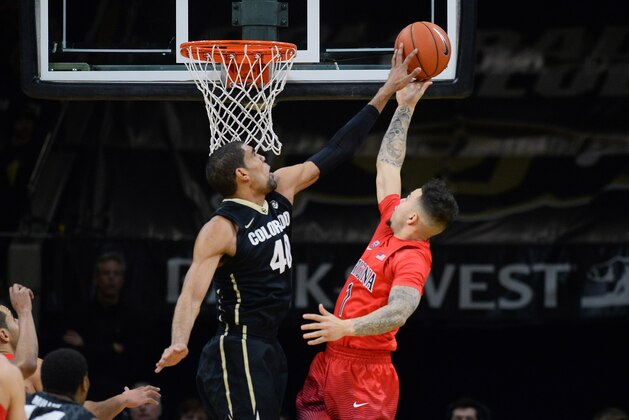 Feb 24, 2016; Boulder, CO, USA; Colorado Buffaloes forward Josh Scott (40) blocks a shot by Arizona Wildcats guard Gabe York (1) in the first half at the Coors Events Center. Mandatory Credit: Ron Chenoy-USA TODAY Sports