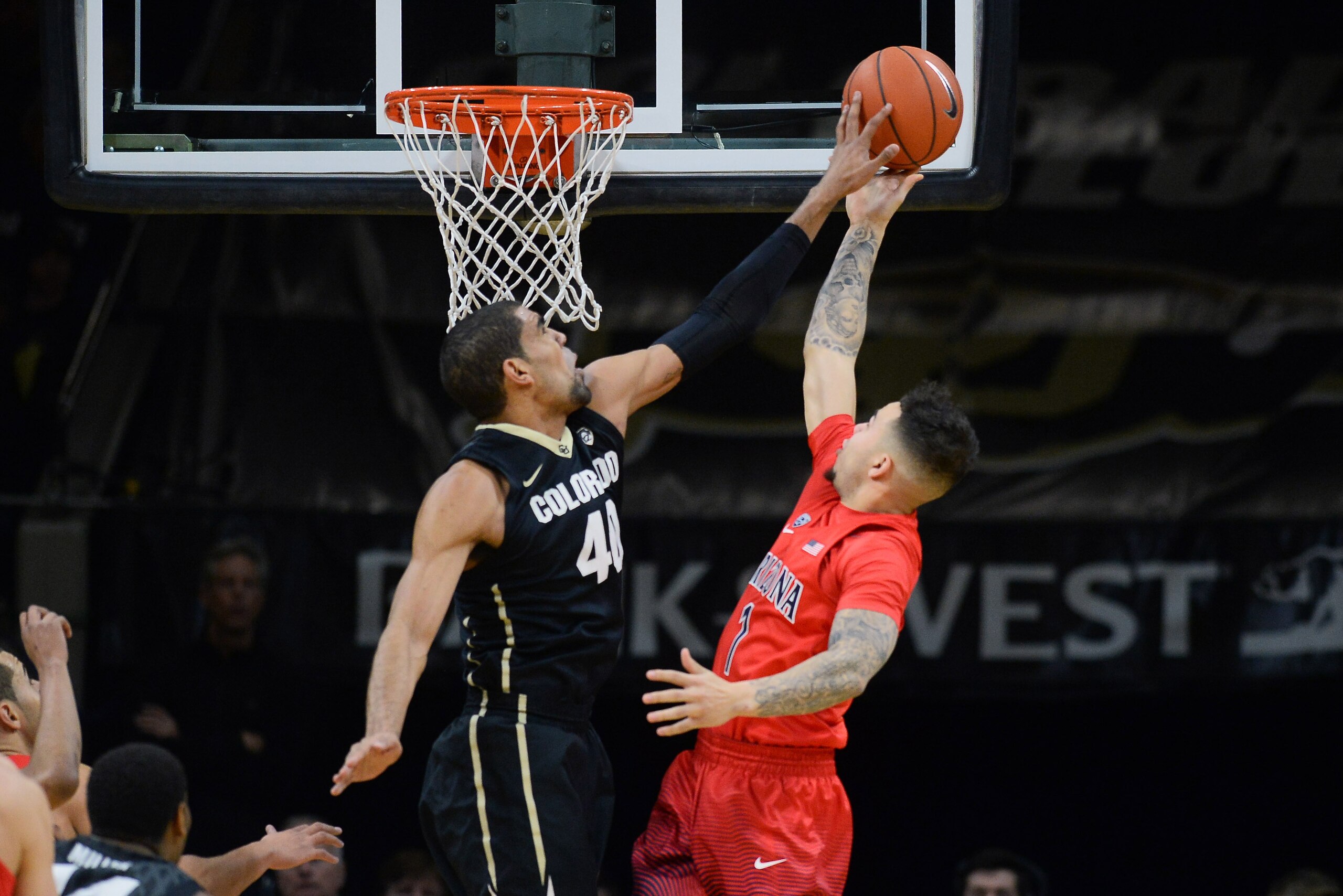 Feb 24, 2016; Boulder, CO, USA; Colorado Buffaloes forward Josh Scott (40) blocks a shot by Arizona Wildcats guard Gabe York (1) in the first half at the Coors Events Center. Mandatory Credit: Ron Chenoy-USA TODAY Sports