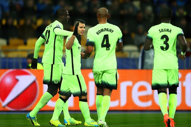 KIEV, UKRAINE - FEBRUARY 24:  Sergio Aguero of Manchester City is congratulated by teammates Yaya Toure and Vincent Kompany after scoring the opening goal during the UEFA Champions League round of 16, first leg match between FC Dynamo Kyiv and Manchester City FC at the Olympic Stadium on February 24, 2016 in Kiev, Ukraine.  (Photo by Michael Steele/Getty Images)