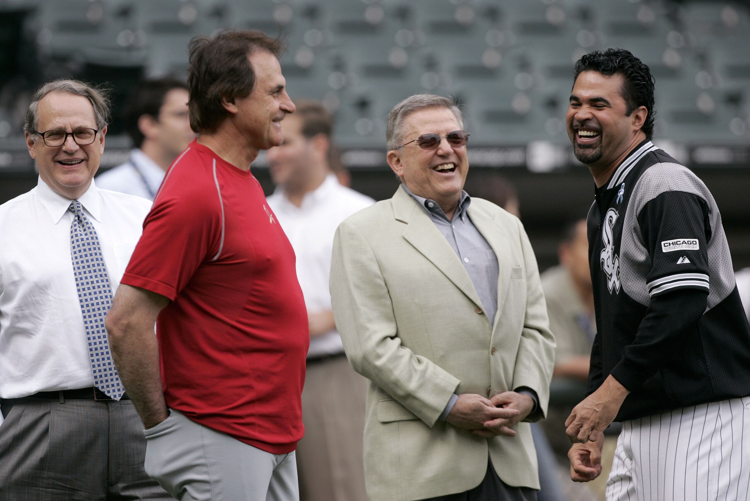 Chicago White Sox chairman Jerry Reinsdorf, left, manager Ozzie Guillen, right, vice chairman Eddie Einhorn, center right, and St. Louis Cardinals manager Tony La Russa talk before a baseball game between the two clubs in Chicago, Tuesday, June 20, 2006. La Russa managed the White Sox from 1979-1986. (AP Photo/Brian Kersey)