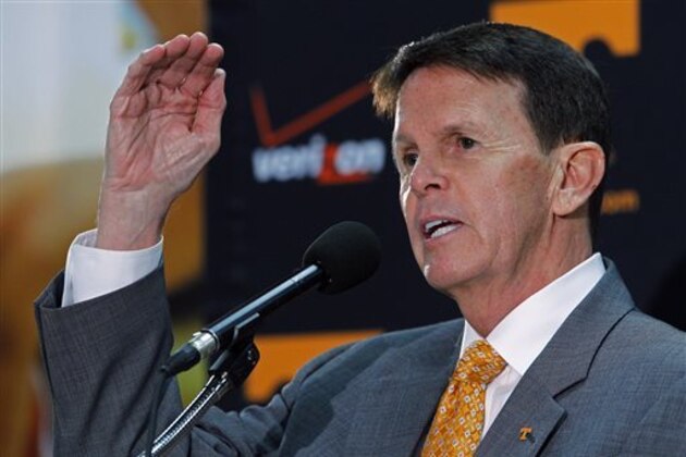 FILE - In this March 27, 2015, file photo, University of Tennessee athletic director Dave Hart gestures as he speaks to reporters about the firing of head basketball coach Donnie Tyndall, in Knoxville, Tenn. Hart is ready to look ahead to 2015-16 after a tumultuous year that included record fundraising and modest improvements on the field but also the abrupt firing of men's basketball coach Donnie Tyndall and criticism over the elimination of the Lady Vols nickname in all sports but basketball. (AP Photo/Wade Payne, File)