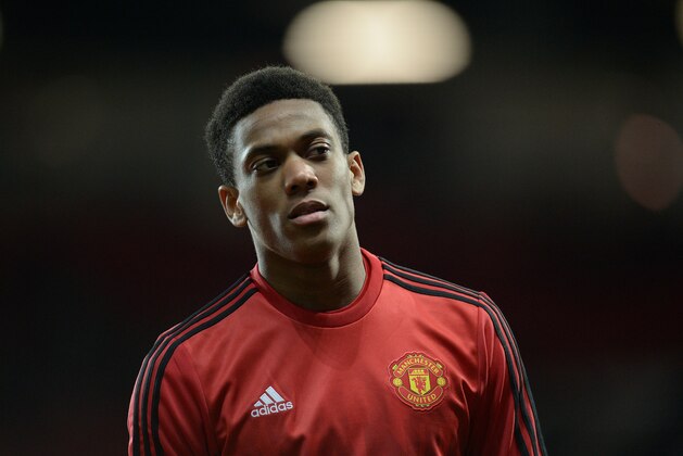 Manchester United's French striker Anthony Martial warms up ahead of the UEFA Europa League round of 32, second leg football match between Manchester United and and FC Midtjylland at Old Trafford in Manchester, north west England, on February 25, 2016. 
 / AFP / OLI SCARFF        (Photo credit should read OLI SCARFF/AFP/Getty Images)