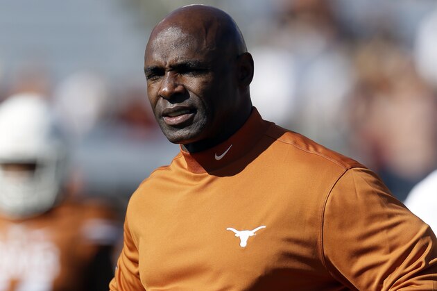 Texas head coach Charlie Strong watches his team warm up before an NCAA college football game against Oklahoma Saturday, Oct. 10, 2015, in Dallas. (AP Photo/LM Otero)