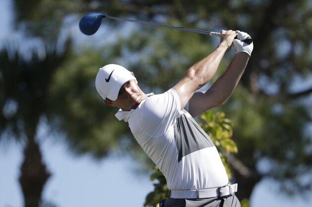 Rory McIlroy, of Northern Ireland, tees off on the fourth hole during the first round of the Honda Classic golf tournament, Thursday, Feb. 25, 2016, in Palm Beach Gardens, Fla. (AP Photo/Lynne Sladky)
