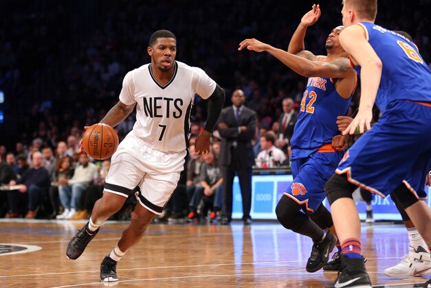 Feb 19, 2016; Brooklyn, NY, USA; Brooklyn Nets small forward Joe Johnson (7) drives against New York Knicks small forward Lance Thomas (42) and power forward Kristaps Porzingis (6) during the third quarter at Barclays Center. The Nets defeated the Knicks 109-98. Mandatory Credit: Brad Penner-USA TODAY Sports
