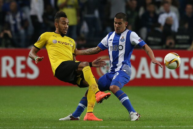 PORTO, PORTUGAL - FEBRUARY 25:  Borussia Dortmund's forward Pierre-Emerick Aubameyang with FC Porto's uruguayan defender Maxi Pereira in action during the UEFA Europa League Round of 32 - Second Leg match between FC Porto and Borussia Dortmund at Estadio do Dragao on February 25, 2015 in Porto, Portugal.  (Photo by Gualter Fatia/Getty Images)