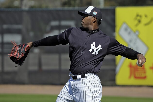 New York Yankees pitcher Aroldis Chapman throws during a spring training baseball workout Friday, Feb. 19, 2016, in Tampa, Fla. (AP Photo/Chris O'Meara)