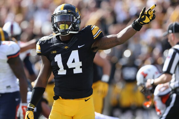 Oct 10, 2015; Iowa City, IA, USA; Iowa Hawkeyes defensive back Desmond King (14) signals for the first down late in the fourth quarter after Iowa recovered a fumble against the Illinois Fighting Illini at Kinnick Stadium. Iowa beat Illinois 29-20.  Mandatory Credit: Reese Strickland-USA TODAY Sports