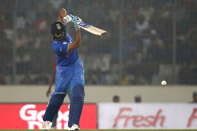 India's Rohit Sharma plays a shot against Bangladesh during the Asia Cup Twenty20 international cricket match in Dhaka, Bangladesh, Wednesday, Feb. 24, 2016. (AP Photo/A.M. Ahad)
