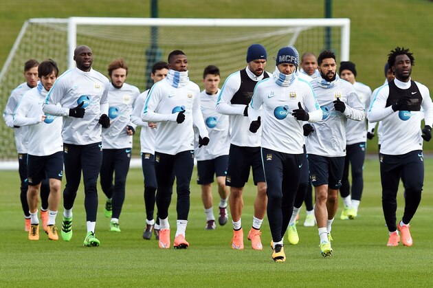 The Manchester City squad take part in a training session in Manchester on February 26, 2016, ahead of the English League Cup Final against Liverpool at Wembley Stadium on Sunday February 28, 2016. AFP PHOTO/PAUL ELLIS / AFP / PAUL ELLIS / RESTRICTED TO EDITORIAL USE. No use with unauthorized audio, video, data, fixture lists, club/league logos or 'live' services. Online in-match use limited to 75 images, no video emulation. No use in betting, games or single club/league/player publications.  /         (Photo credit should read PAUL ELLIS/AFP/Getty Images)