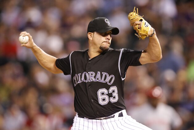 Colorado Rockies relief pitcher Rafael Betancourt (63) works against the Cincinnati Reds in the ninth inning of a baseball game Saturday, July 25, 2015, in Denver. Cincinnati won 5-2. (AP Photo/David Zalubowski)