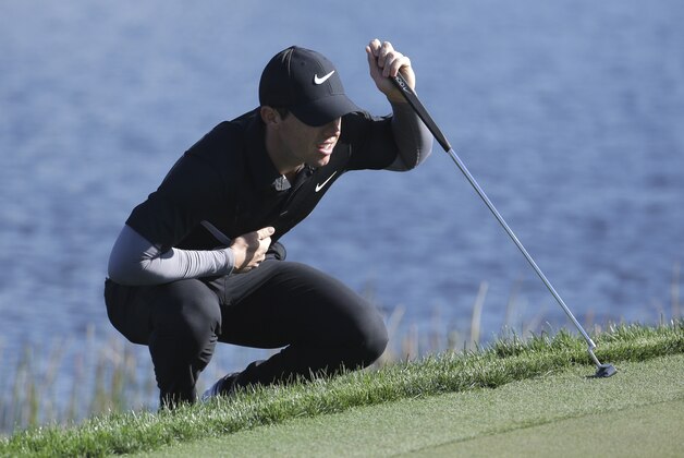 Rory McIlroy, of Northern Ireland, lines up a putt on the 14th hole during the second round of the Honda Classic golf tournament, Friday, Feb. 26, 2016, in Palm Beach Gardens, Fla. (AP Photo/Lynne Sladky)