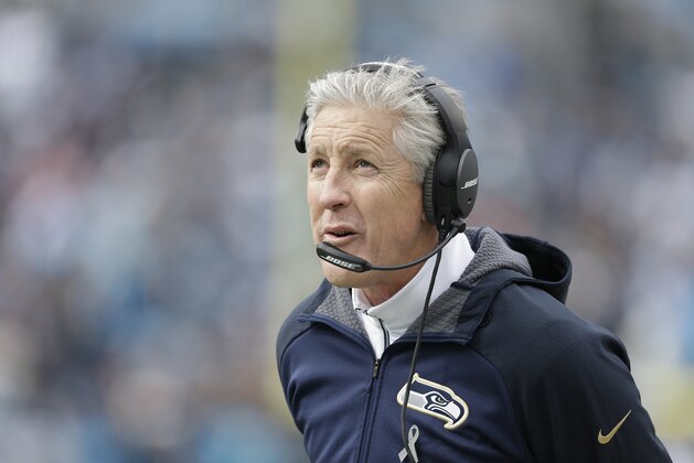 Seattle Seahawks head coach Pete Carroll watches play against the Carolina Panthers during the first half of an NFL divisional playoff football game, Sunday, Jan. 17, 2016, in Charlotte, N.C. (AP Photo/Bob Leverone)