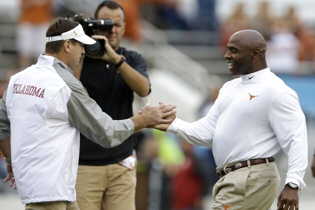 Texas head coach Charlie Strong, right, and Oklahoma head coach Bob Stoops greet each other before an NCAA college football game at the Cotton Bowl, Saturday, Oct. 11, 2014, in Dallas. (AP Photo/LM Otero) Texas head coach Charlie Strong, right, and Oklahoma head coach Bob Stoops greet each other before an NCAA college football game at the Cotton Bowl, Saturday, Oct. 11, 2014, in Dallas. (AP Photo/LM Otero)