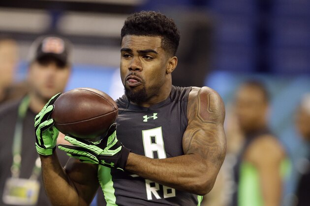 Ohio State running back Ezekiel Elliott reaches for a pass during a drill at the NFL football scouting combine on Friday, Feb. 26, 2016, in Indianapolis. (AP Photo/Darron Cummings)