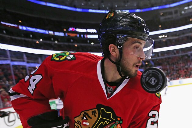 CHICAGO, IL - FEBRUARY 15: The puck flies past the face of Phillip Danault #24 of the Chicago Blackhawks during a game against the Toronto Maple Leafs at the United Center on February 15, 2016 in Chicago, Illinois. (Photo by Jonathan Daniel/Getty Images)