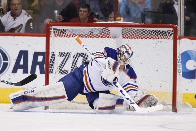 Edmonton Oilers' Anders Nilsson, of Sweden, makes a save on a shot against the Arizona Coyotes during the first period of an NHL hockey game Tuesday, Jan. 12, 2016, in Glendale, Ariz.  The Coyotes defeated the Oilers 4-3 in overtime. (AP Photo/Ross D. Franklin)