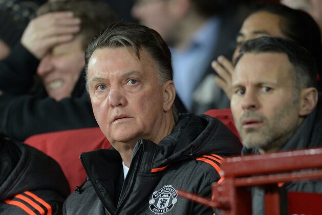 Manchester United's Dutch manager Louis van Gaal (L) and Manchester United's Welsh assistant manager Ryan Giggs wait for the start of the UEFA Europa League round of 32, second leg football match between Manchester United and and FC Midtjylland at Old Trafford in Manchester, north west England, on February 25, 2016.  / AFP / OLI SCARFF        (Photo credit should read OLI SCARFF/AFP/Getty Images)