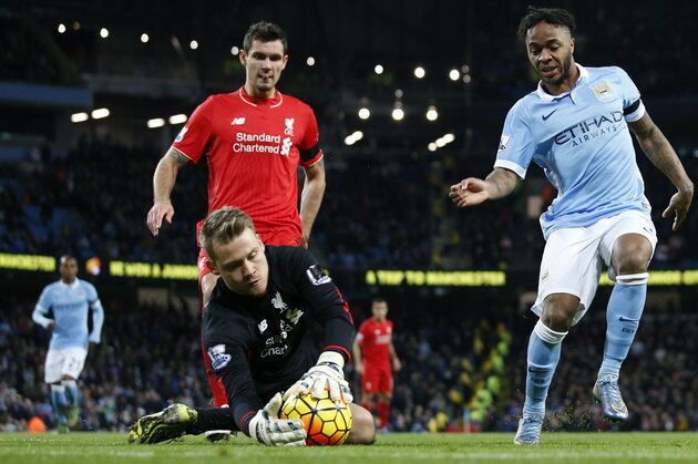 Manchester City's Raheem Sterling, right , looks down and Liverpool’s goalkeeper Simon Mignolet gathers the ball  during the English Premier League soccer match between Manchester City and Liverpool at the Etihad Stadium, Manchester, England, Saturday, Nov. 21, 2015. (AP Photo/Jon Super)