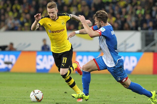 Hoffenheim's Bosnian defender Ermin Bicakcic (R) and Dortmund's striker Marco Reus vie for the ball during the German first division Bundesliga football match TSG 1899 Hoffenheim vs Borussia Dortmund in Sinsheim, on September 23, 2015.    AFP PHOTO / DANIEL ROLAND  RESTRICTIONS: DURING MATCH TIME: DFL RULES TO LIMIT THE ONLINE USAGE TO 15 PICTURES PER MATCH AND FORBID IMAGE SEQUENCES TO SIMULATE VIDEO.  ==RESTRICTED TO EDITORIAL USE == FOR FURTHER QUERIES PLEASE  CONTACT THE  DFL DIRECTLY AT + 49 69 650050.        (Photo credit should read DANIEL ROLAND/AFP/Getty Images)