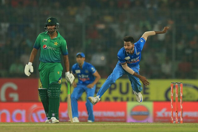 Indian cricketer HH Pandya delivers a ball  during the match between India and Pakistan at the Asia Cup T20 cricket tournament at the Sher-e-Bangla National Cricket Stadium in Dhaka on February 27, 2016. AFP PHOTO / STR / AFP / STR        (Photo credit should read STR/AFP/Getty Images)