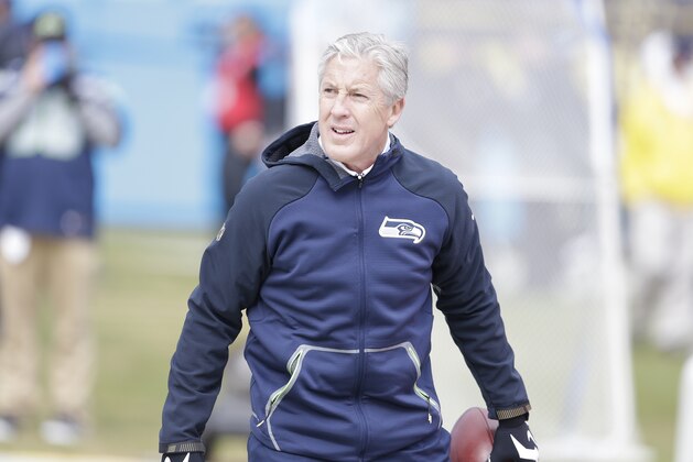 Seattle Seahawks head coach Pete Carroll warms up before the first half of an NFL divisional playoff football game between the Carolina Panthers and the Seattle Seahawks, Sunday, Jan. 17, 2016, in Charlotte, N.C. (AP Photo/Bob Leverone)