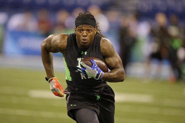 Alabama running back Derrick Henry runs a drill at the NFL football scouting combine in Saturday, Feb. 27, 2016, in Indianapolis. (AP Photo/Darron Cummings)