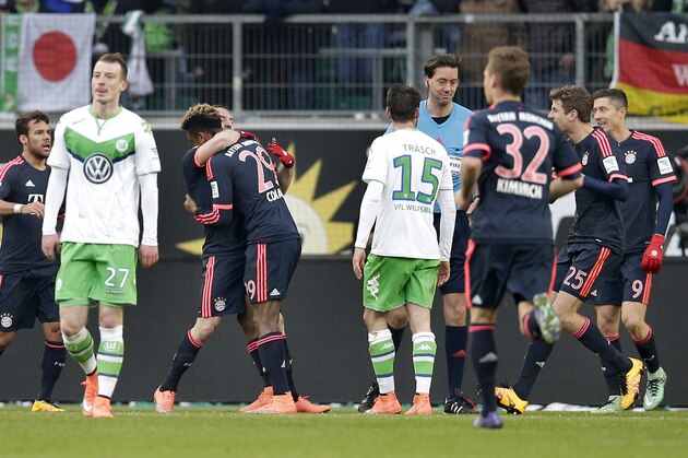 Bayern’s Kingsley Coman, fourth left, and his teammates celebrate their side's opening goal during the German Bundesliga soccer match between VfL Wolfsburg and FC Bayern Munich in Wolfsburg, Germany, Saturday, Feb. 27, 2016. (AP Photo/Michael Sohn)