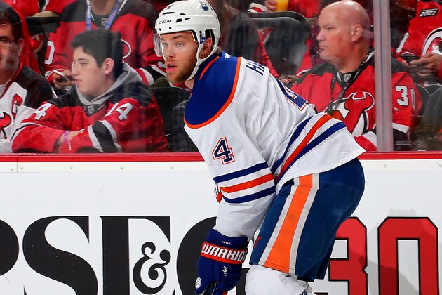 NEWARK, NJ - FEBRUARY 09:  Taylor Hall #4 of the Edmonton Oilers takes the puck in the second period against the New Jersey Devils on February 9, 2016 at Prudential Center in Newark, New Jersey.  (Photo by Elsa/Getty Images)