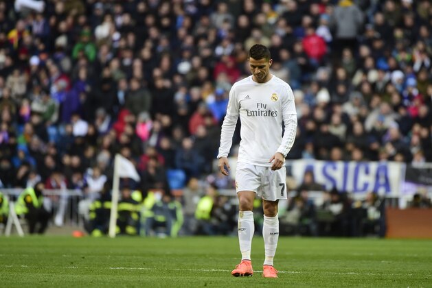 Real Madrid's Portuguese forward Cristiano Ronaldo looks downwards during the Spanish league football match Real Madrid CF vs Club Atletico de Madrid at the Santiago Bernabeu stadium in Madrid on February 27, 2016. / AFP / PIERRE-PHILIPPE MARCOU        (Photo credit should read PIERRE-PHILIPPE MARCOU/AFP/Getty Images)