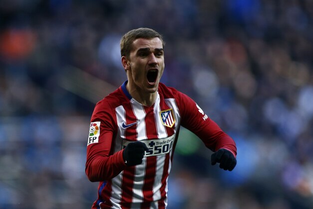 Atletico's Antoine Griezmann celebrates after scoring the opening goal during a Spanish La Liga soccer match between Real Madrid and Atletico Madrid at the Santiago Bernabeu stadium in Madrid, Saturday Feb. 27, 2016. (AP Photo/Oscar del Pozo)
