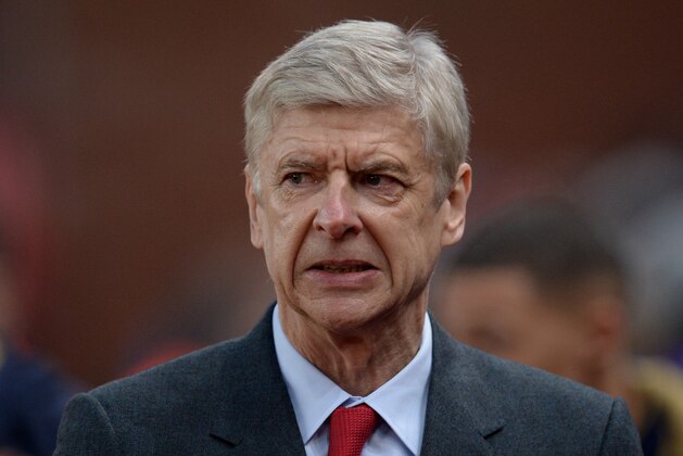 Arsenal's French manager Arsene Wenger reacts ahead of the English Premier League football match between Stoke City and Arsenal at the Britannia Stadium in Stoke-on-Trent, central England on January 17, 2016. AFP PHOTO / OLI SCARFF

RESTRICTED TO EDITORIAL USE. No use with unauthorized audio, video, data, fixture lists, club/league logos or 'live' services. Online in-match use limited to 75 images, no video emulation. No use in betting, games or single club/league/player publications.. / AFP / OLI SCARFF        (Photo credit should read OLI SCARFF/AFP/Getty Images)