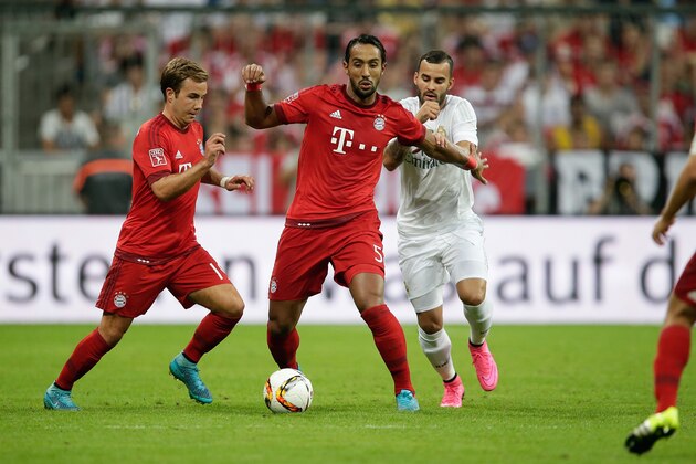 (L-R) Mario Gotze of FC Bayern Munchen, Medhi Benatia of FC Bayern Munchen during the AUDI Cup final match between Real Madrid and FC Bayern Munich on August 5, 2015 at the Allianz Arena in Munich, Germany(Photo by VI Images via Getty Images)