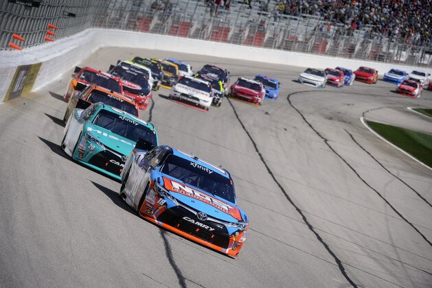 Pole sitter Kyle Busch leads the field early in a NASCAR XFinity Series auto race at Atlanta Motor Speedway Saturday, Feb. 27, 2016, in Hampton, Ga. (AP Photo/John Amis)