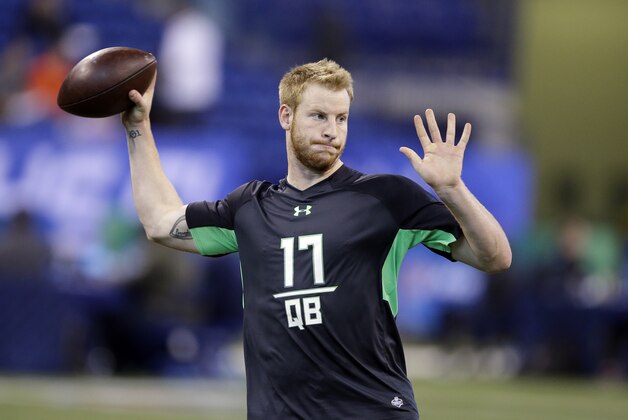 North Dakota State quarterback Carson Wentz runs a drill at the NFL football scouting combine on Saturday, Feb. 27, 2016, in Indianapolis. (AP Photo/Darron Cummings)