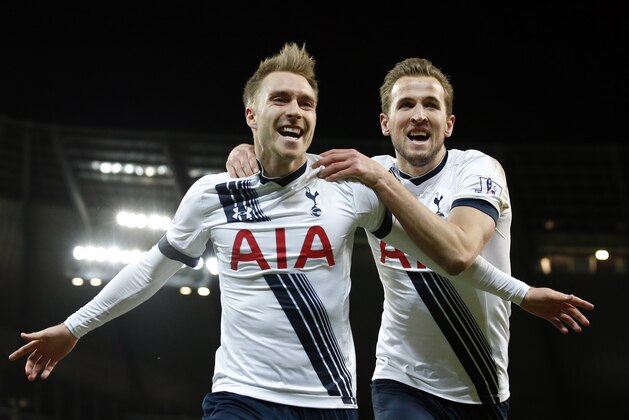 Tottenham's Christian Eriksen, left, celebrates  with Harry Kane after scoring his side’s second goal during the English Premier League soccer match between Manchester City and Tottenham Hotspur's at the Etihad Stadium in Manchester, England, Sunday Feb. 14, 2016. (AP Photo/Jon Super)
