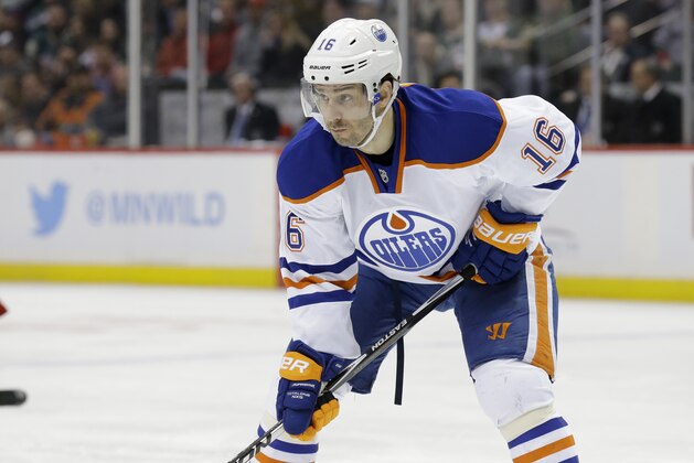 Edmonton Oilers right wing Teddy Purcell (16) gets into position for a face-off against the Minnesota Wild during the second period of an NHL hockey game in St. Paul, Minn., Tuesday, Feb. 24, 2015. (AP Photo/Ann Heisenfelt)