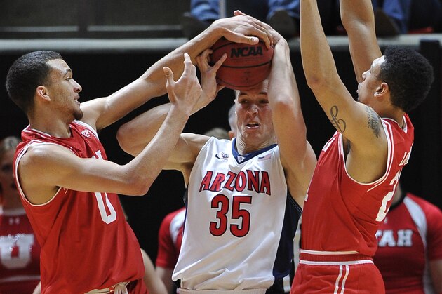 SALT LAKE CITY, UT - FEBRUARY 27: Brekkott Chapman #0 and Jordan Loveridge #21 of the Utah Utes defend against Kaleb Tarczewski #35 of the Arizona Wildcats in the first half of their game at the Jon M. Huntsman Center on February 27, 2016 in Salt Lake City, Utah. (Photo by Gene Sweeney Jr/Getty Images)