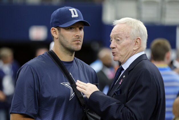 Dallas Cowboys owner Jerry Jones, right, talks with injured quarterback Tony Romo, left, before an NFL football game against the New England Patriots, Sunday, Oct. 11, 2015, in Arlington, Texas. (AP Photo/Brandon Wade)