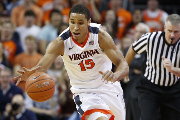 Virginia guard Malcolm Brogdon drives up the court during the second half of an NCAA college basketball game against North Carolina in Charlottesville, Va., Saturday, Feb. 27, 2016. Virginia won 79-74. (AP Photo/Steve Helber)