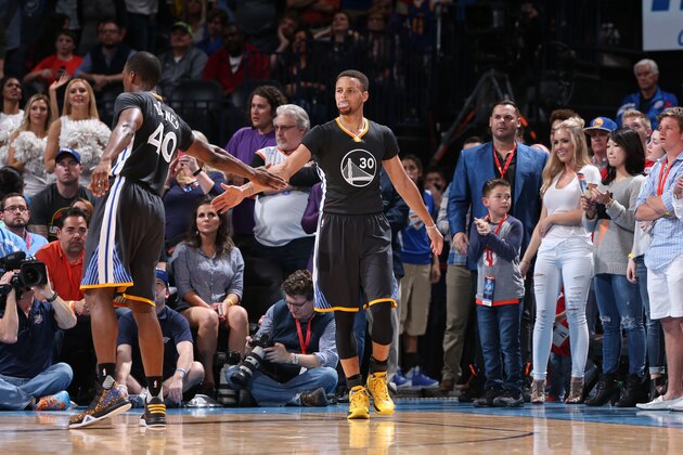 OKLAHOMA CITY, OK - FEBRUARY 27:  Stephen Curry #30 of the Golden State Warriors high fives Harrison Barnes #40 of the Golden State Warriors during the game against the Oklahoma City Thunder on February 27, 2016 at Chesapeake Energy Arena in Oklahoma City, Oklahoma. NOTE TO USER: User expressly acknowledges and agrees that, by downloading and or using this photograph, User is consenting to the terms and conditions of the Getty Images License Agreement. Mandatory Copyright Notice: Copyright 2016 NBAE (Photo by Joe Murphy/NBAE via Getty Images)