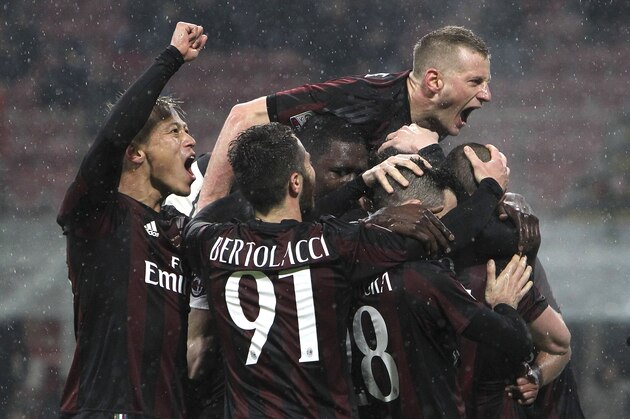 MILAN, ITALY - FEBRUARY 27:  Luca Antonelli of AC Milan celebrates with his team-mates after scoring the opening goal during the Serie A match between AC Milan and Torino FC at Stadio Giuseppe Meazza on February 27, 2016 in Milan, Italy.  (Photo by Marco Luzzani/Getty Images)