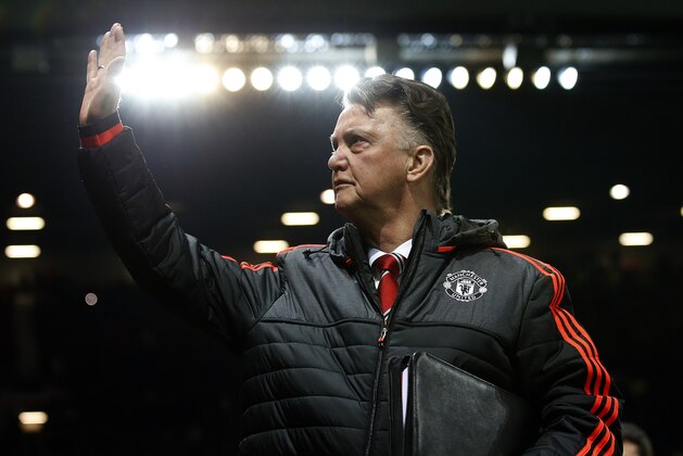 United’s manager Louis van Gaal waves during the Europa League round of 32 second leg soccer match between Manchester United and FC Midtjylland in Manchester, England, Thursday, Feb. 25, 2016 . (AP Photo/Jon Super)