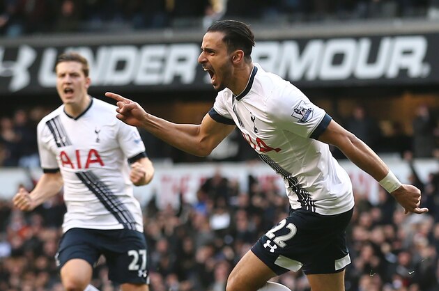 Tottenham Hotspur's Belgian midfielder Nacer Chadli (R) celebrates after scoring their first goal during the English Premier League football match between Tottenham Hotspur and Swansea City at White Hart Lane in London, on February 28, 2016.
Tottenham won the game 2-1. / AFP / JUSTIN TALLIS / RESTRICTED TO EDITORIAL USE. No use with unauthorized audio, video, data, fixture lists, club/league logos or 'live' services. Online in-match use limited to 75 images, no video emulation. No use in betting, games or single club/league/player publications.  /         (Photo credit should read JUSTIN TALLIS/AFP/Getty Images)