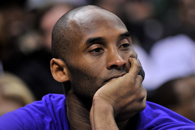 Los Angeles Lakers forward Kobe Bryant watches sits on the bench in the first half of an NBA basketball game Wednesday, Feb. 24, 2016, in Memphis, Tenn. (AP Photo/Brandon Dill)