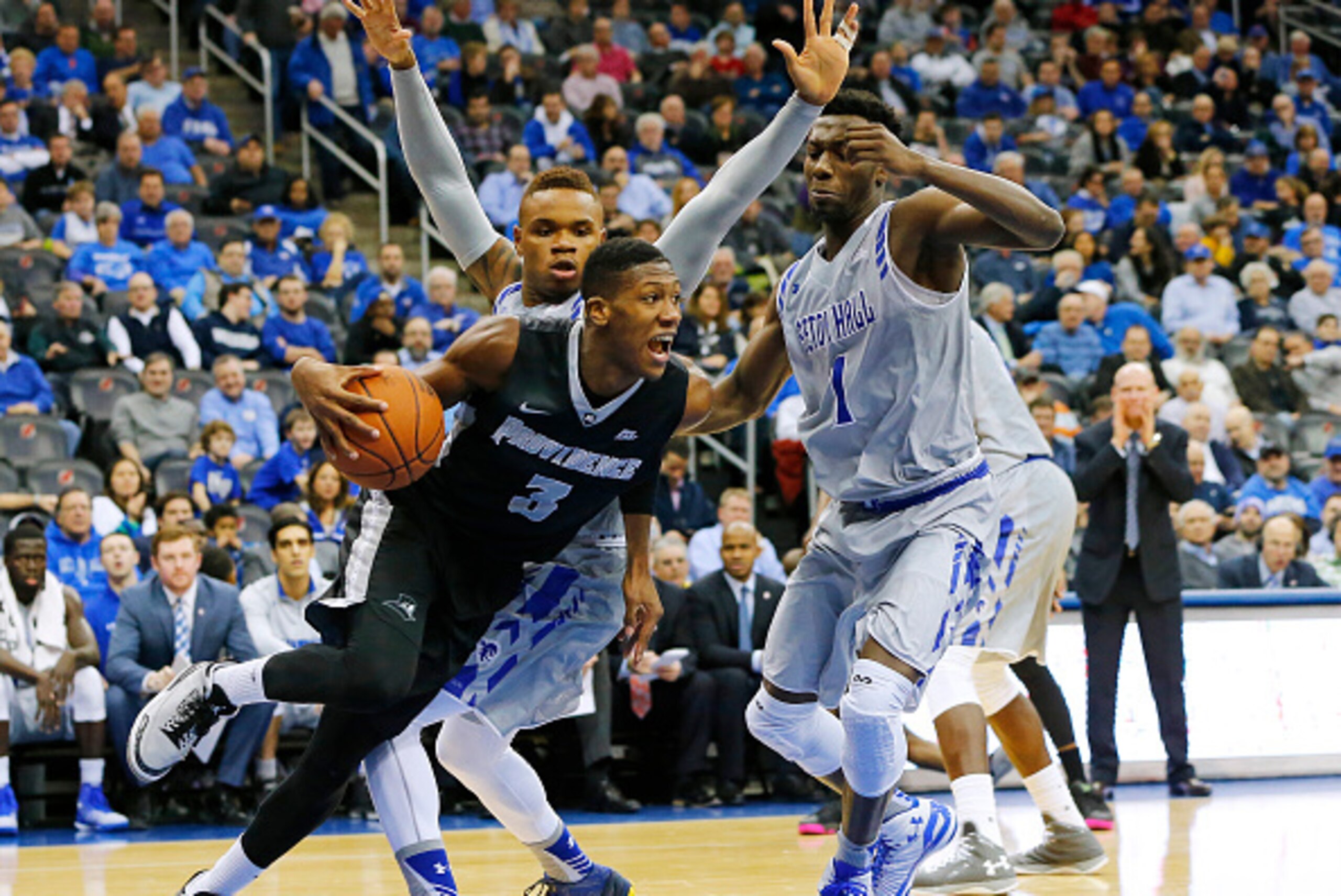 NEWARK, NJ - FEBRUARY 25: Kris Dunn #3 of the Providence Friars drives to the basket as Derrick Gordon #32, left, and Michael Nzei #1 of the Seton Hall Pirates defend during the first half of an NCAA college basketball game on February 25, 2016 at the Prudential Center in Newark, New Jersey. (Photo by Rich Schultz /Getty Images)