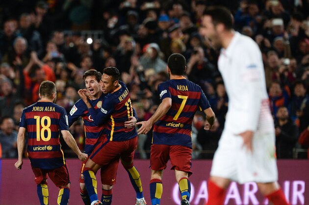 Barcelona's Argentinian forward Lionel Messi (2nd L) celebrates a goal with Barcelona's Brazilian forward Neymar (3rd L) and other teammates during the Spanish league football match FC Barcelona vs Sevilla FC at the Camp Nou stadium in Barcelona on February 28, 2016. / AFP / JOSEP LAGO        (Photo credit should read JOSEP LAGO/AFP/Getty Images)